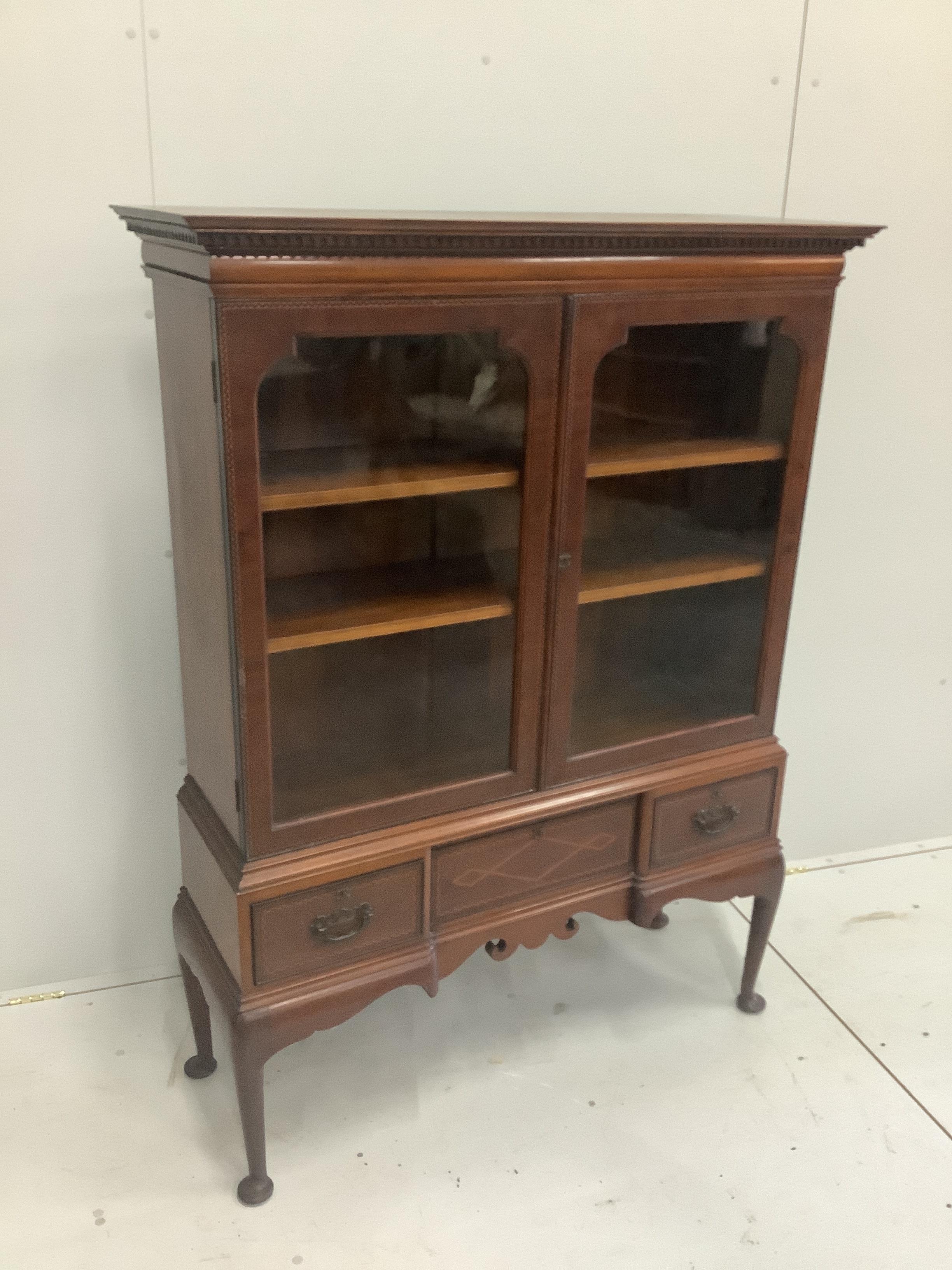 An Edwardian inlaid mahogany bookcase, width 112cm, height 152cm